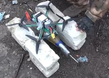 A quadcopter drone modified to carry an explosive device.